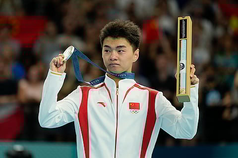 Wang Zisai of China celebrates after winning the silver medal